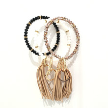 Load image into Gallery viewer, Bracelet keychain is 10" and includes a detachable key ring and a decorative tassel.  Comes in white/gold, black/gold and copper/gold.