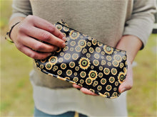 Load image into Gallery viewer, Clutch 5" x 8-1/4" with matching zipper tag and wrist handle. 4 prints available Black Snakeskin, Brown Snakeskin, Leopard and Black with Yellow flowers.