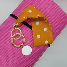 Load image into Gallery viewer, These swank keychains are functional and spirited! Show off your fun personality! No reason to carry your whole purse to class or the gym. Simply slip the soft fabric over your wrist and your keys/key cards/card wallet are at your fingertips in seconds. In addition to the split ring, these key chains also have a detachable key ring, with a tag charm you can personalize, for added convenience.   3 fabrics - Brown snake skin, Mustard white polka dot & Leopard