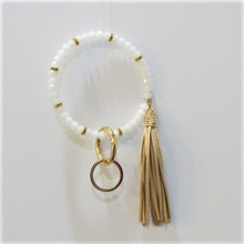 Load image into Gallery viewer, Bracelet keychain is 10" and includes a detachable key ring and a decorative tassel.  Comes in white/gold, black/gold and copper/gold.