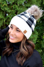 Load image into Gallery viewer, This beanie says, You&#39;ve got it together! This beanie has a white ban that then changes to a black &amp; white plaid with a faux fur pom to top it off. This knit beanie is fleece lined for added warmth too. 
