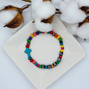 This colorful beaded stretch bracelet is for Your Champ! Is your champ the athlete, the musician, the book worm, or the big hearted giver? Whoever it is, they deserve to know. What better way to tell them than with a boost bracelet.