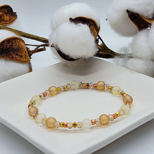 Load image into Gallery viewer, One of our top favorites is this dainty champagne beaded bracelet with gold accent beads. This delicate bracelet can be dressed up or down. The bracelet is a must have to add to your quick grab &amp; go collection.
