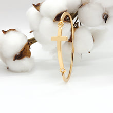 Load image into Gallery viewer, This beautiful cross cuff bracelet is a welcome piece at any occasion! It is delicate enough in appearance to wear for a formal event &amp; durable enough to wear camping. The bracelet latches by using the cross charm, which is a unique feature.
