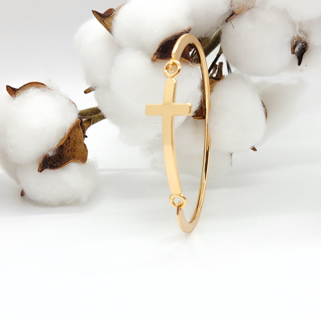 This beautiful cross cuff bracelet is a welcome piece at any occasion! It is delicate enough in appearance to wear for a formal event & durable enough to wear camping. The bracelet latches by using the cross charm, which is a unique feature.