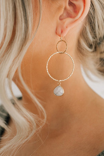 These double gold filled hoop earrings have a Howlite stone at the bottom of the second hoop bringing the drop to 3