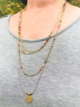 Load image into Gallery viewer, This delicate layered charm and beaded necklace will bring the warmth this fall. The colors of the beads are warm yellow, red, purple and blue which bring out the rose gold hue in the necklace. The full length is 14.5&quot;.
