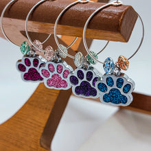 Load image into Gallery viewer, There&#39;s no denying that there are quite a few Dog/Cat Mom&#39;s that are wine lovers too! We&#39;ve enjoyed adding these paw print wine charms to our wine accessories. Each paw print is a different color and the accent beads are colorful too. These paw charms are definitely a step in the right direction to add some joy to your event! Set of 8.
