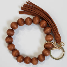 Load image into Gallery viewer, Wooden ball key chain comes with a clasp and a stylish tassel too.
