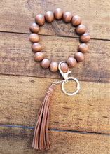 Load image into Gallery viewer, Wooden ball key chain comes with a clasp and a stylish tassel too.
